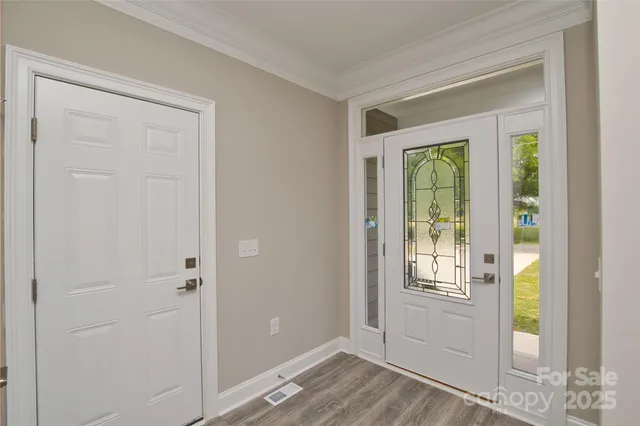 a close view of a refrigerator in a white wall