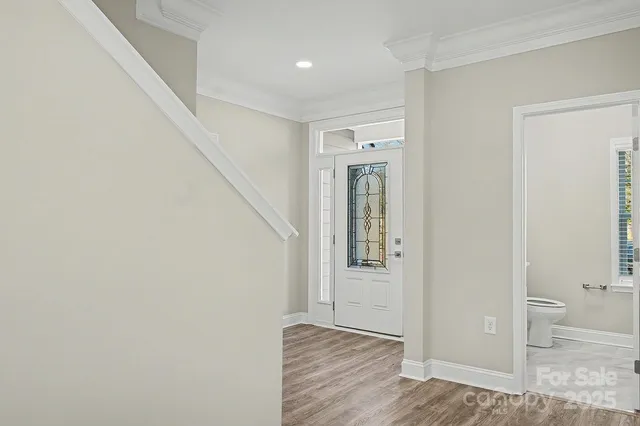 a view of entryway with wooden floor