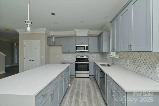 a room with a bed and a chandelier