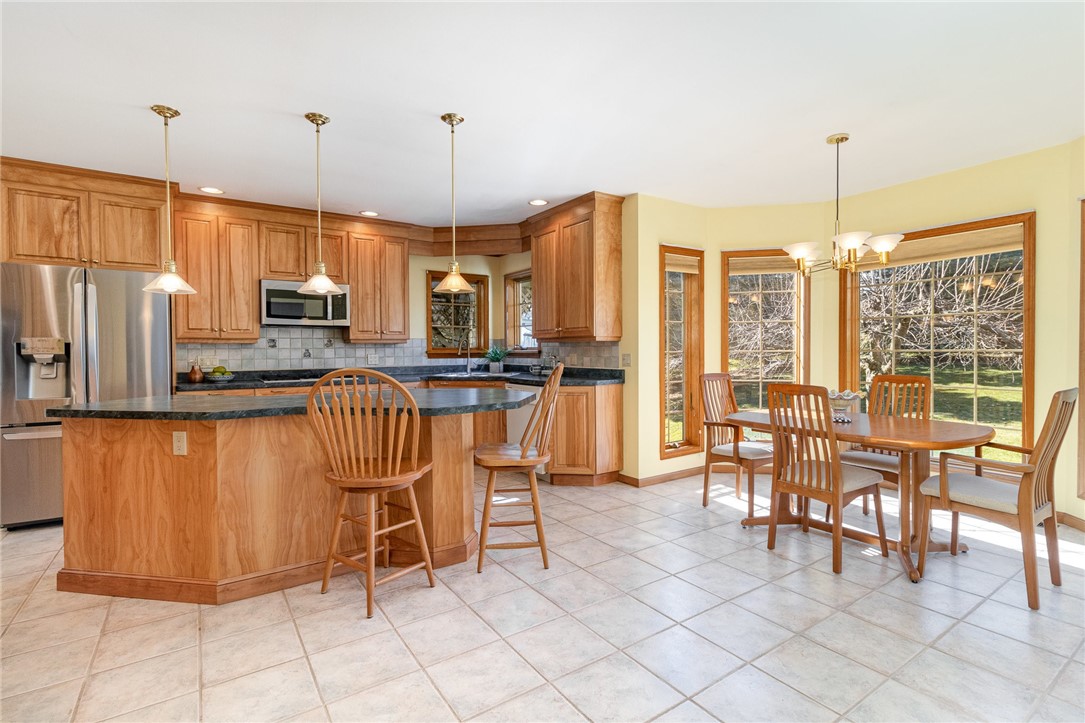 3 Glen Eagle Way Perinton, NY 14450 - Photo 4 of 43 Spacious kitchen. Truer cabinet color in subsequen