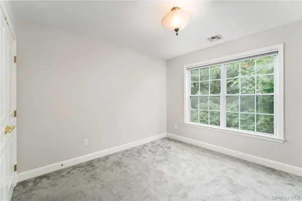 a view of a hallway with stairs