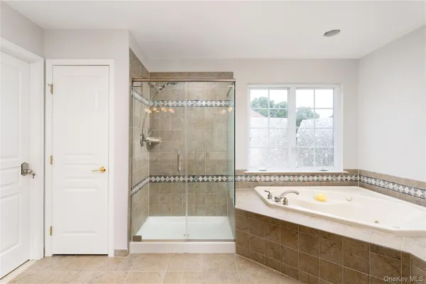 a spacious bathroom with a sink double vanity and mirror