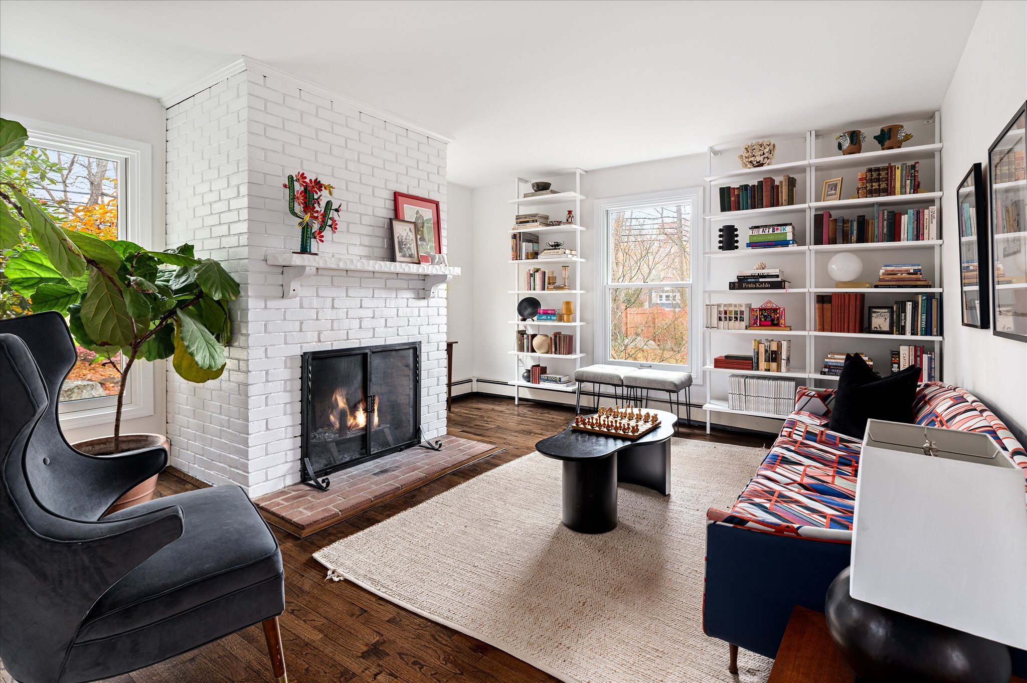 115 Mayapple Road Stamford, CT 06903 - Photo 12 of 38 a living room with furniture fireplace and potted plant