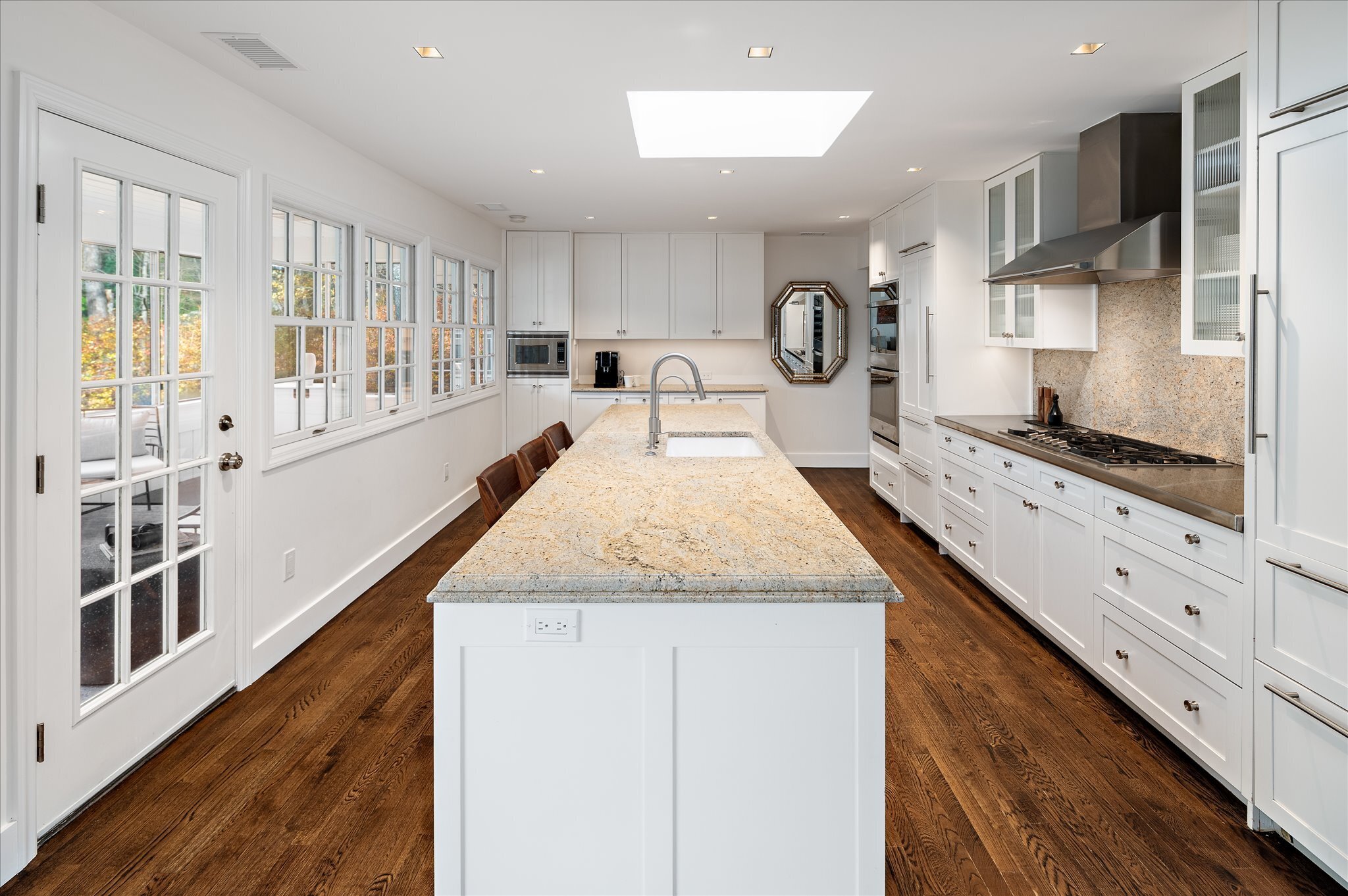 115 Mayapple Road Stamford, CT 06903 - Photo 16 of 38 a large kitchen with granite countertop a large counter top appliances and a view of living room