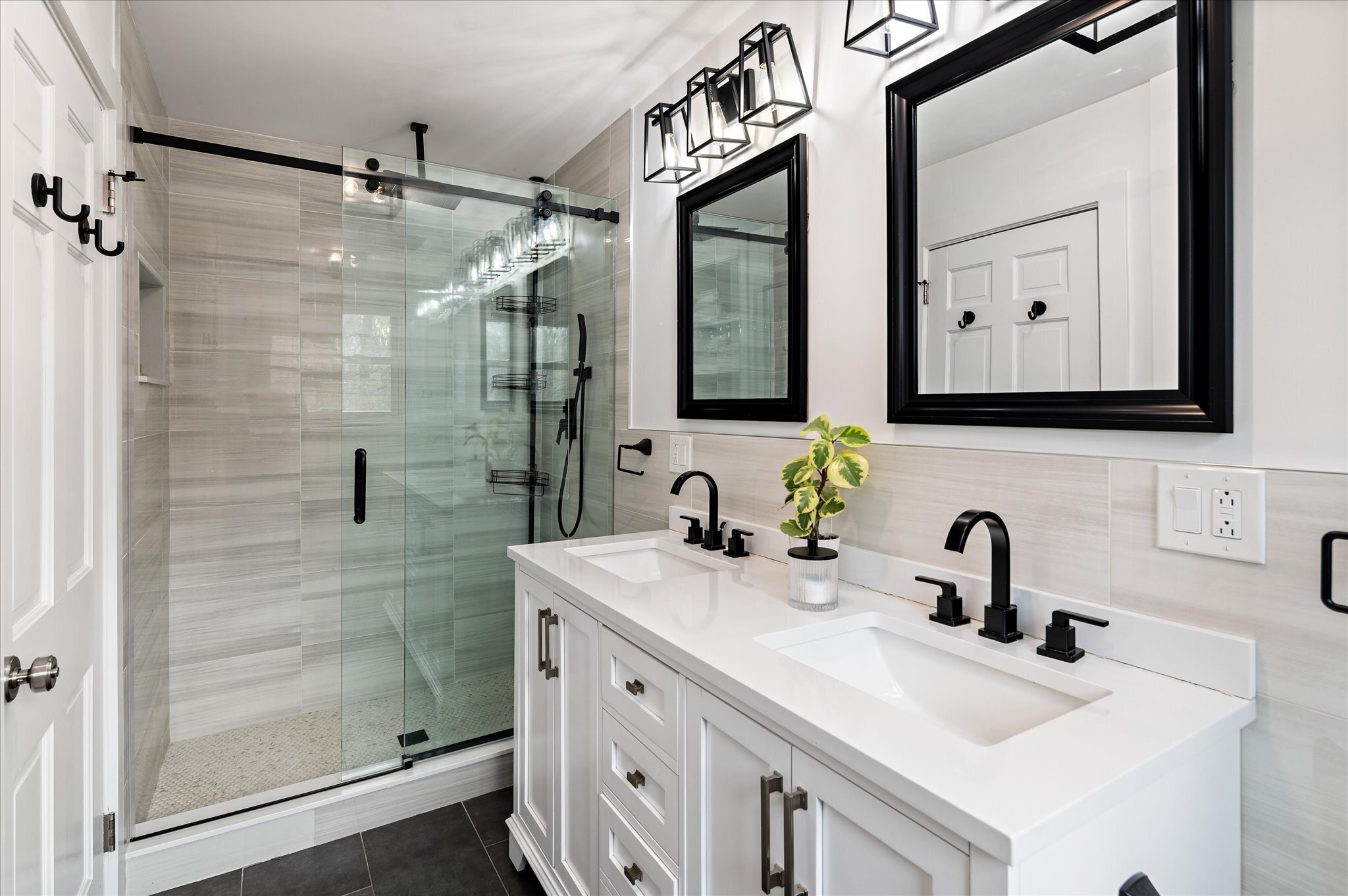 115 Mayapple Road Stamford, CT 06903 - Photo 26 of 38 a bathroom with a sink a mirror a glass door and shower