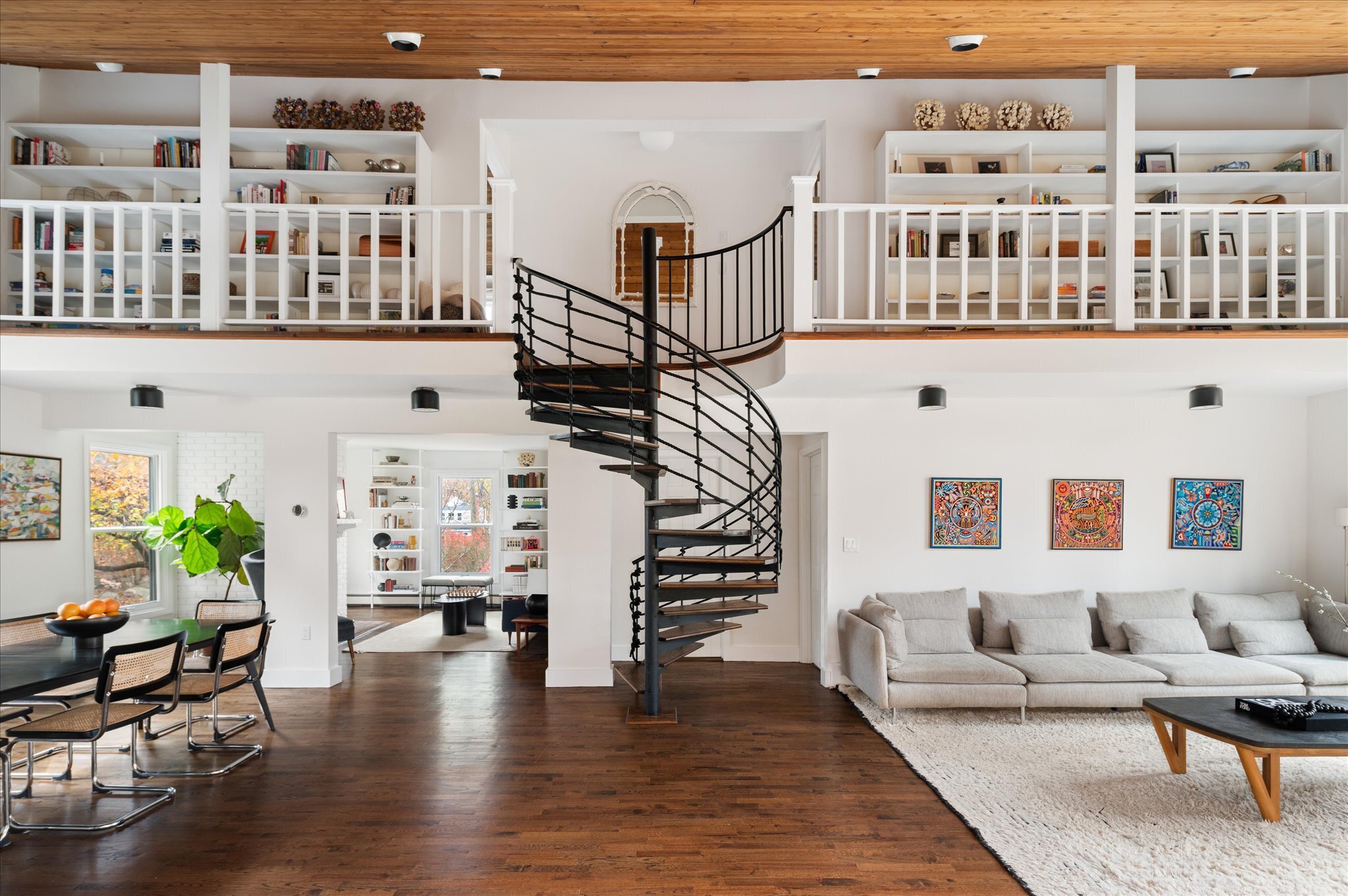 115 Mayapple Road Stamford, CT 06903 - Photo 4 of 38 a living room with furniture stairs and a book shelf