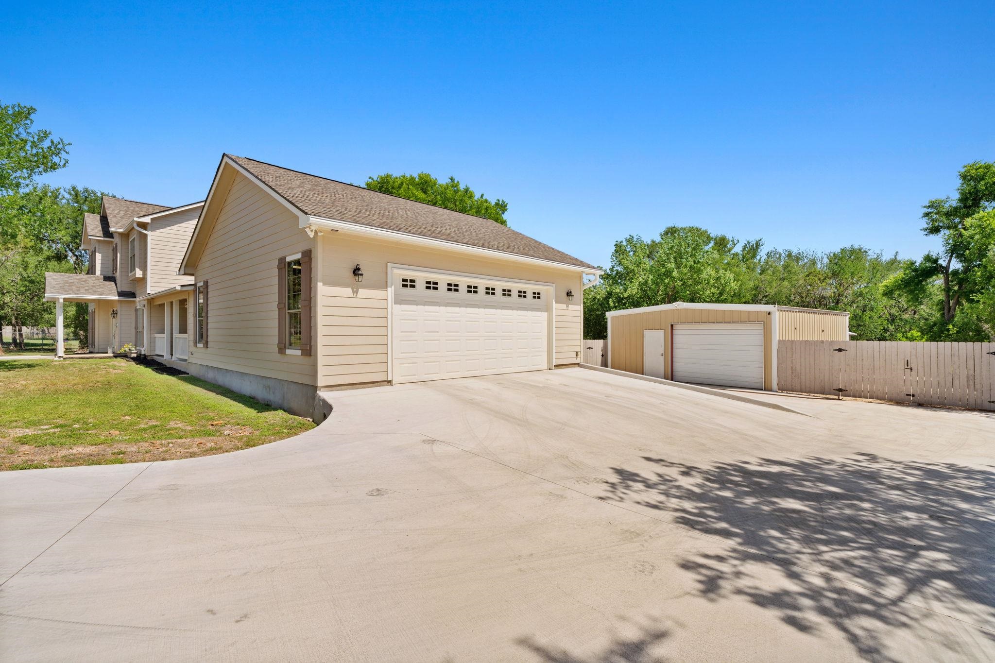 2409 Mormon Mill Road Marble Falls, TX 78654 - Photo 18 of 30 a view of a house with a backyard