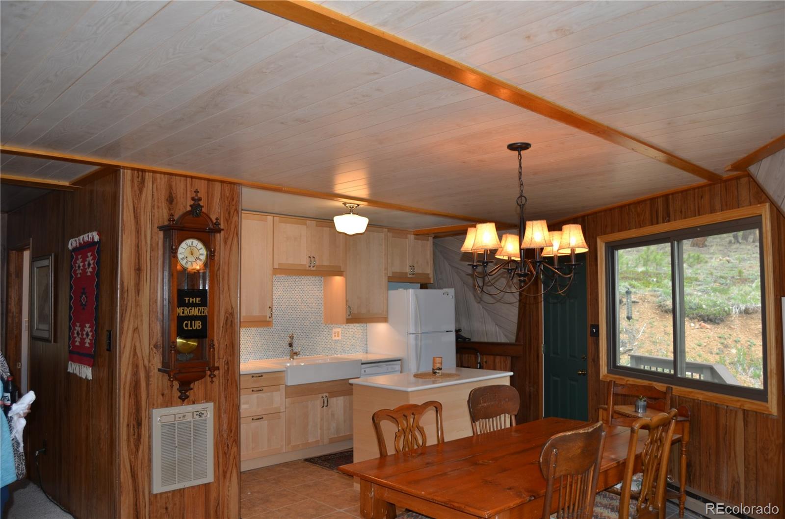 195 Baker Road Bailey, CO 80421 - Photo 14 of 24 a very nice looking room with a large window and chandelier