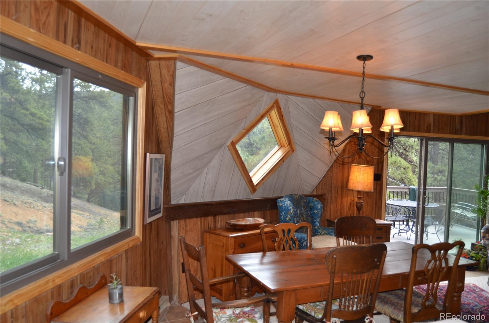 195 Baker Road Bailey, CO 80421 - Photo 15 of 24 a dining room with furniture window and outside view