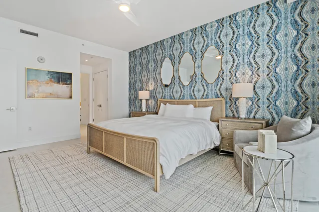 a bathroom with a double vanity sink mirror and shower