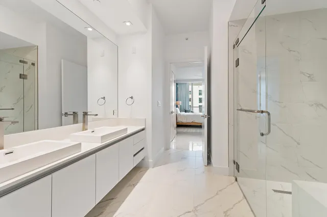 a bathroom with a bathtub and shower