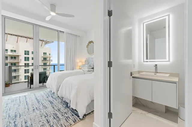 a bedroom with a large bed and a window