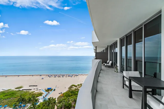 a living room with dining table a table and chairs