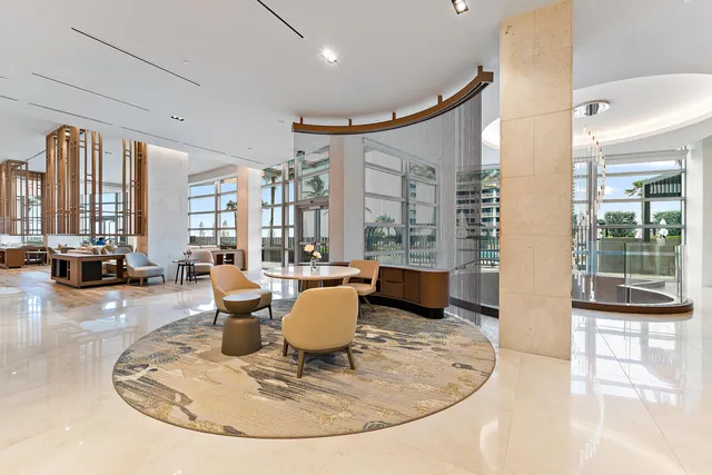 a room with lots of furniture and wooden floors