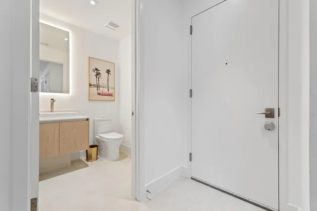 a bathroom with a toilet sink and a shower