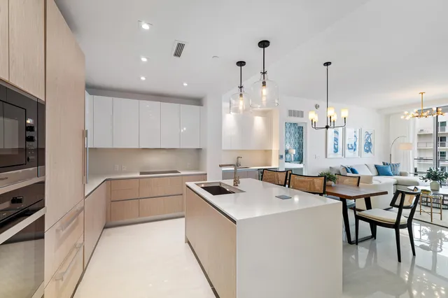 a kitchen with a white cabinets and white appliances