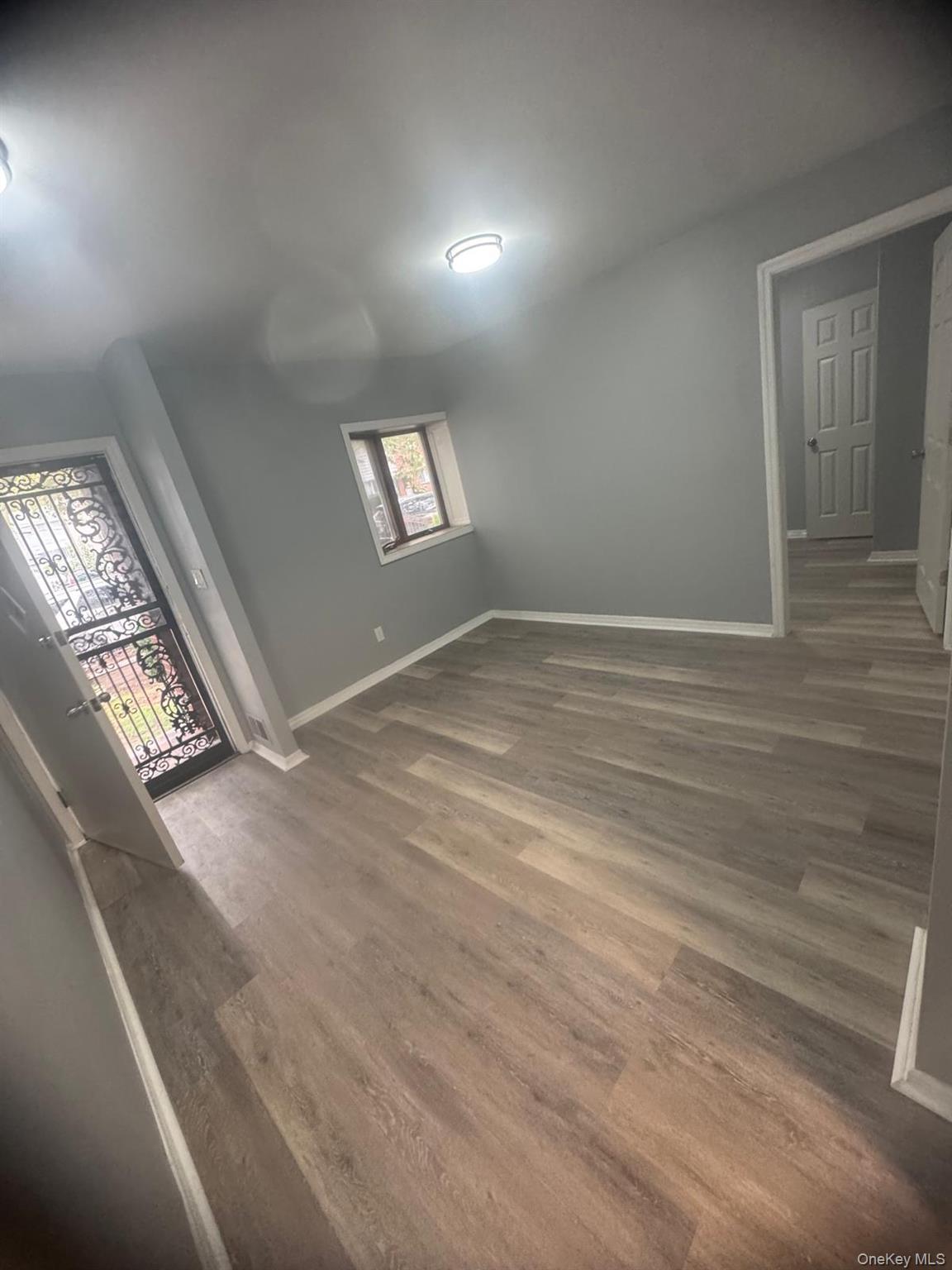 116-23 Inwood Street Queens, NY 11436 - Photo 13 of 22 a view of empty room with window