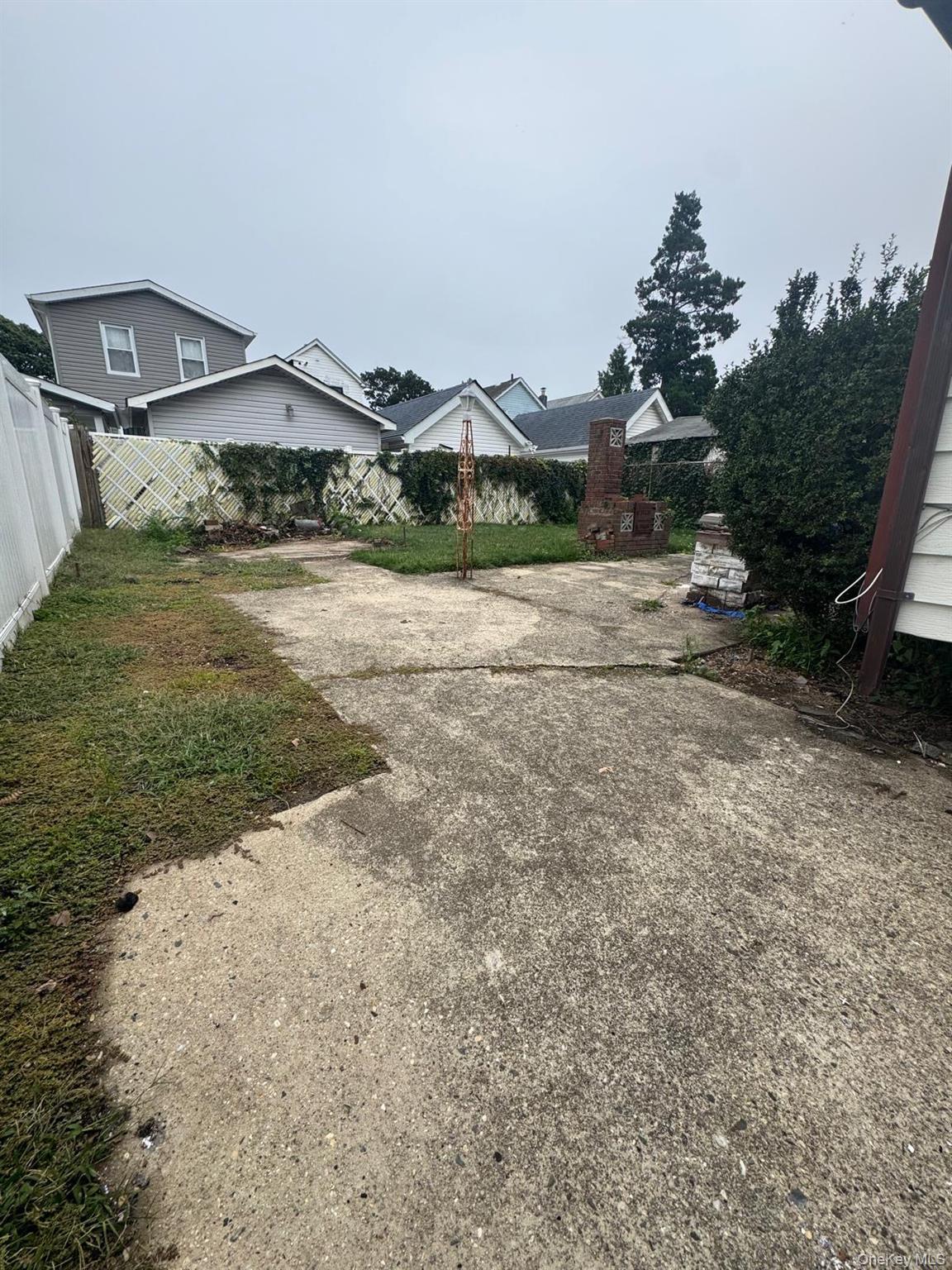116-23 Inwood Street Queens, NY 11436 - Photo 14 of 22 a view of outdoor space and yard