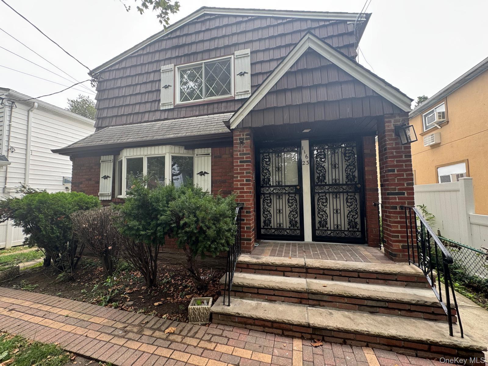116-23 Inwood Street Queens, NY 11436 - Photo 4 of 22 a view of a house with entryway and stairs