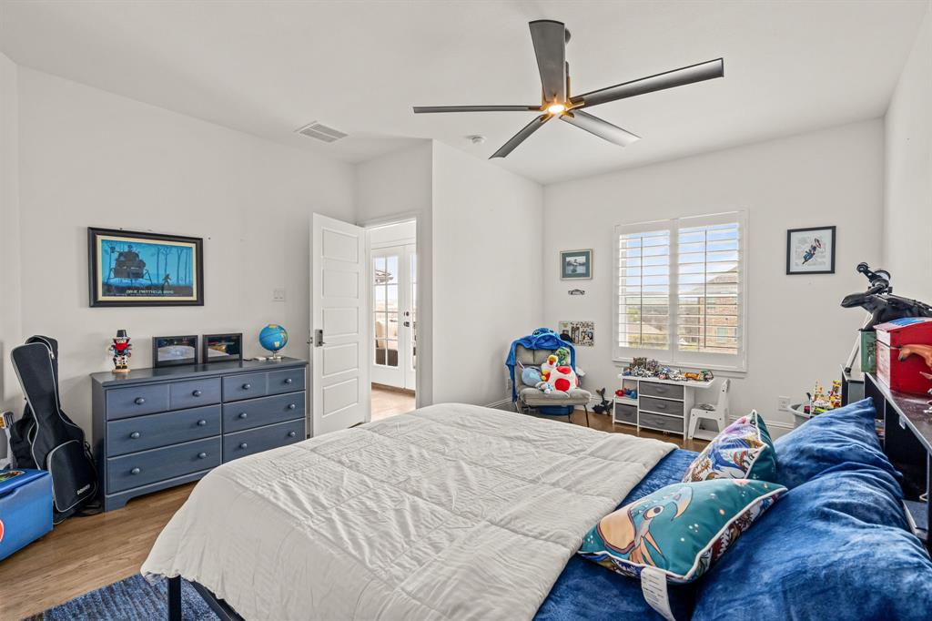1616 Prairie Ridge Road Fort Worth, TX 76008 - Photo 32 of 40 a bed room with a bed and a tv