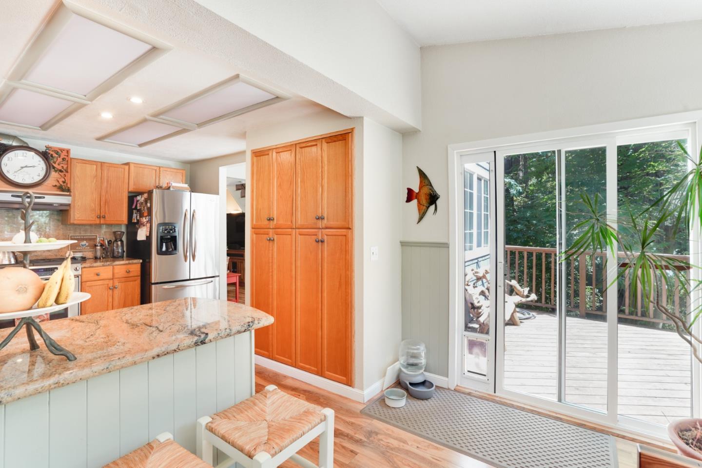 64 Pope Road La Honda, CA 94020 - Photo 14 of 32 a dining hall with stainless steel appliances granite countertop a refrigerator and a sink