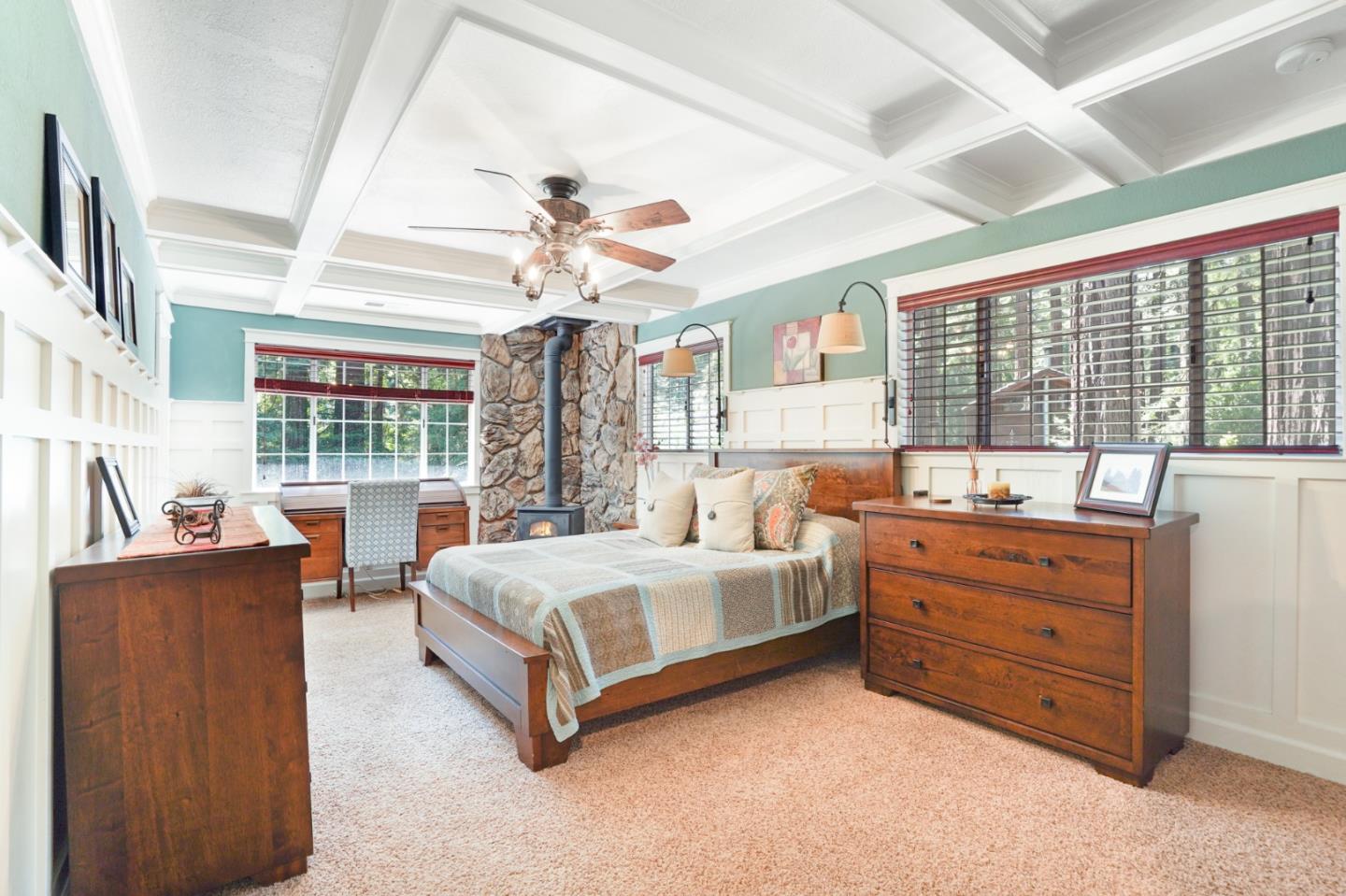 64 Pope Road La Honda, CA 94020 - Photo 15 of 32 a spacious bedroom with a bed and large windows