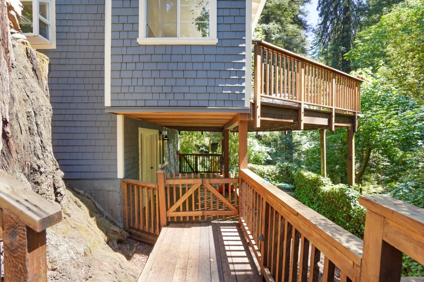 64 Pope Road La Honda, CA 94020 - Photo 26 of 32 a view of a wooden house with a yard
