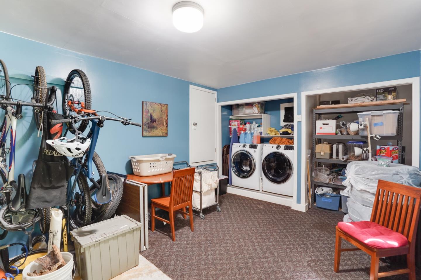 64 Pope Road La Honda, CA 94020 - Photo 29 of 32 a living room with furniture a washer and dryer