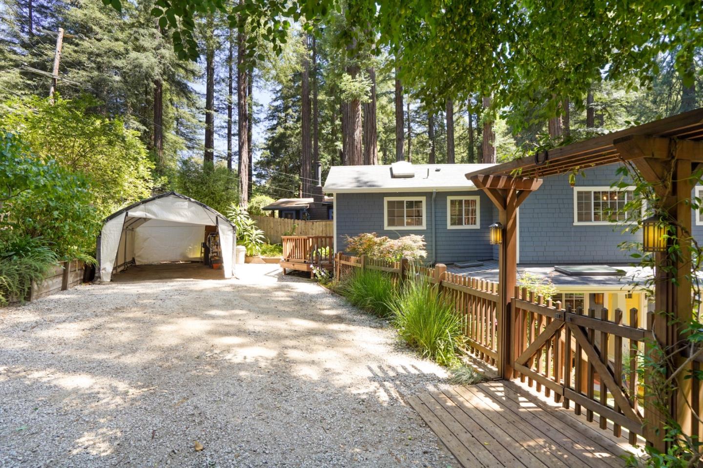 64 Pope Road La Honda, CA 94020 - Photo 4 of 32 a front view of a house with a garden