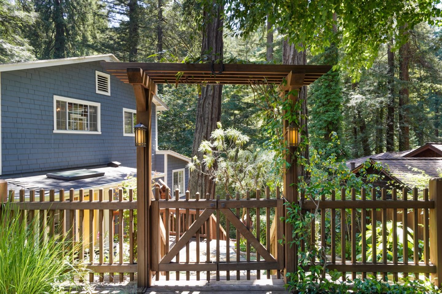 64 Pope Road La Honda, CA 94020 - Photo 6 of 32 a front view of a house with a yard