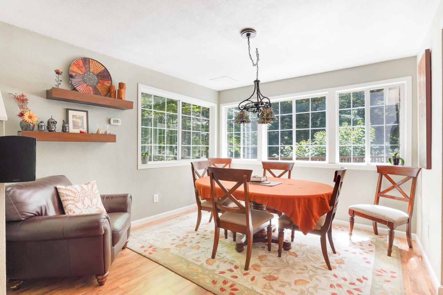 64 Pope Road La Honda, CA 94020 - Photo 9 of 32 a view of a dining room with furniture large windows and wooden floor