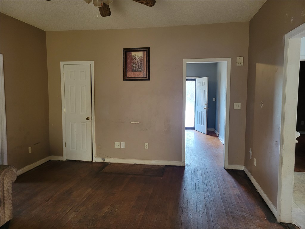 1208 East Main Street Seneca, SC 29678 - Photo 12 of 19 Warm wood floors and light walls create an inviting open concept living space.