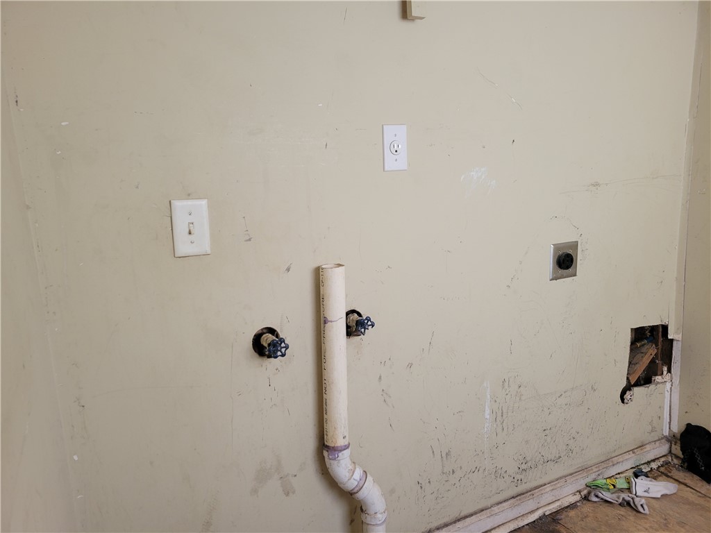 1208 East Main Street Seneca, SC 29678 - Photo 18 of 19 This dedicated laundry space offers essential hookups, ready for your appliances.