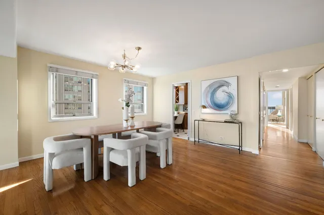 a view of a dining room with furniture and wooden floor