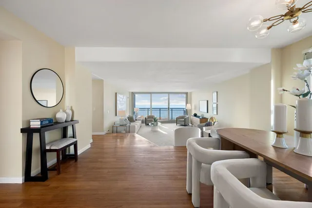 a living room with furniture a window and a fireplace