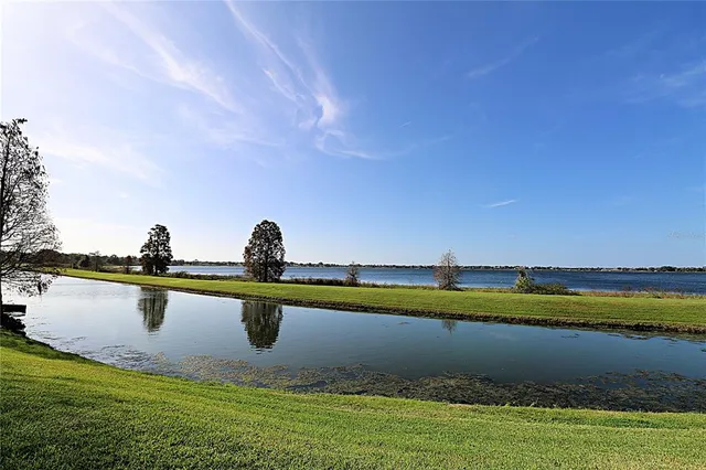 a view of a lake with a big yard