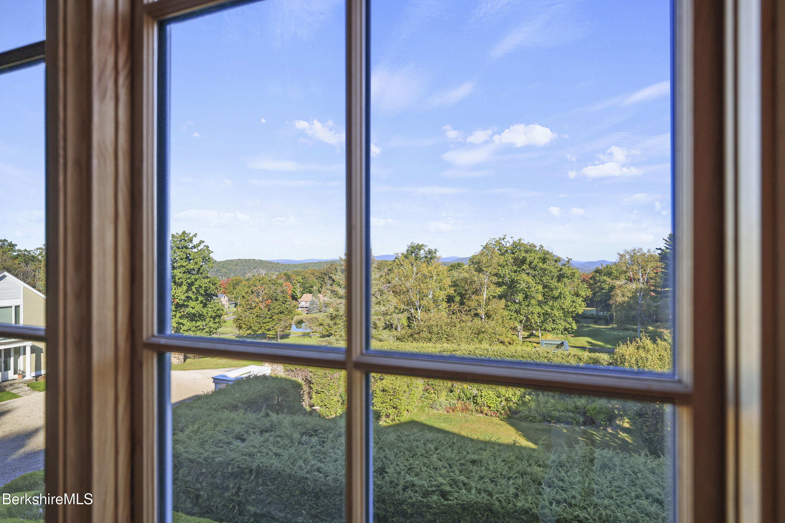209 Blue Hill Road Great Barrington, MA 01230 - Photo 16 of 46 a view of a room with a large window