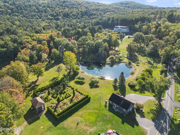 a living room with furniture fireplace and a large window