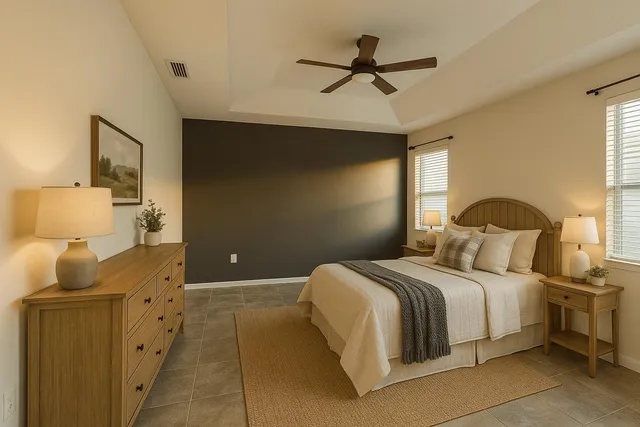 a bedroom with a bed and a chandelier