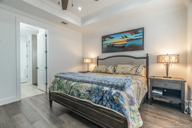 a bedroom with a bed and a night stand