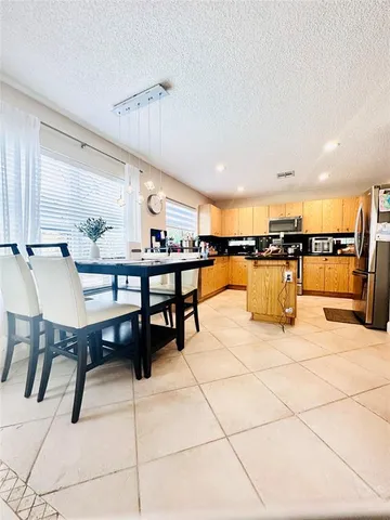 a dining room with furniture and a table