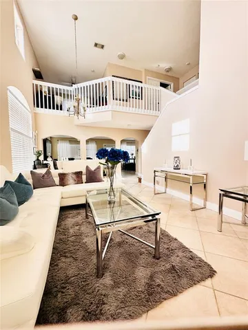 a living room with lots of furniture and white walls