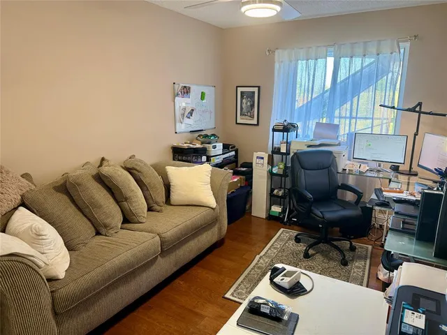 a living room with furniture and a window