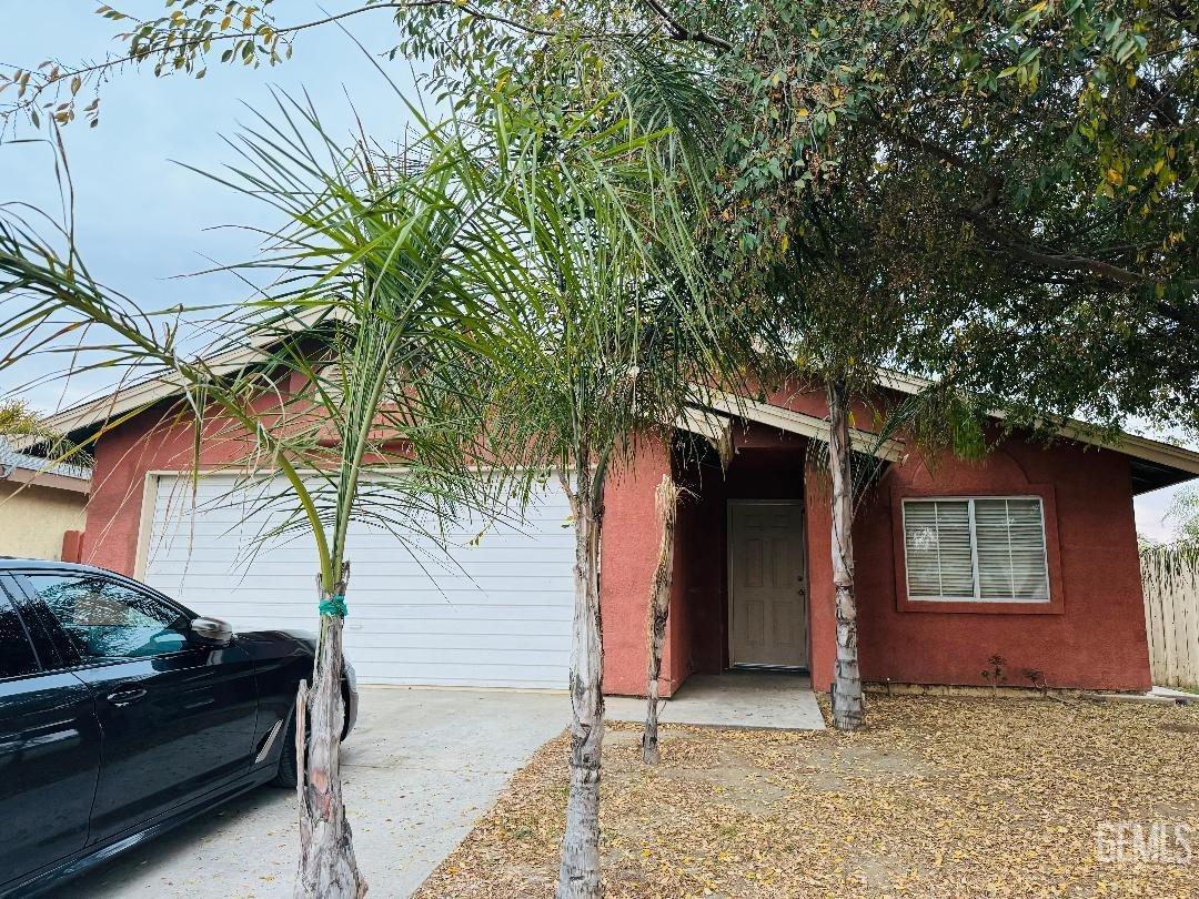 Undisclosed Address Arvin, CA 93203 - Photo 1 of 29 a house with trees in front of it