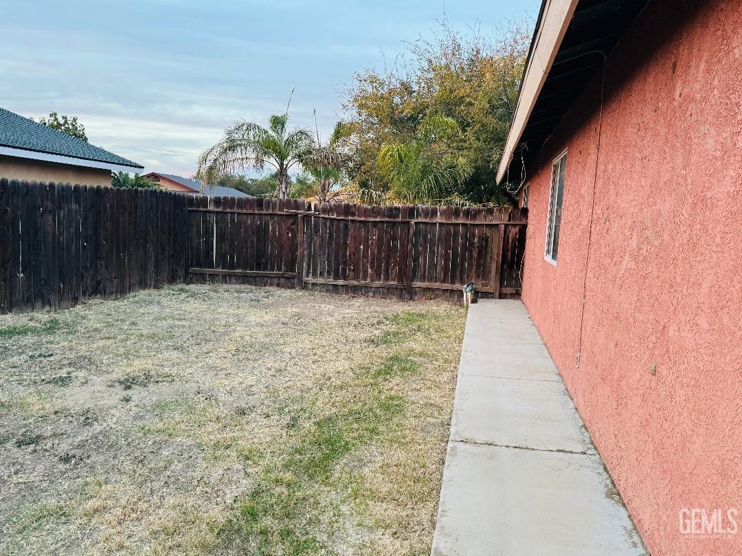 Undisclosed Address Arvin, CA 93203 - Photo 11 of 29 a view of small garden with wooden fence