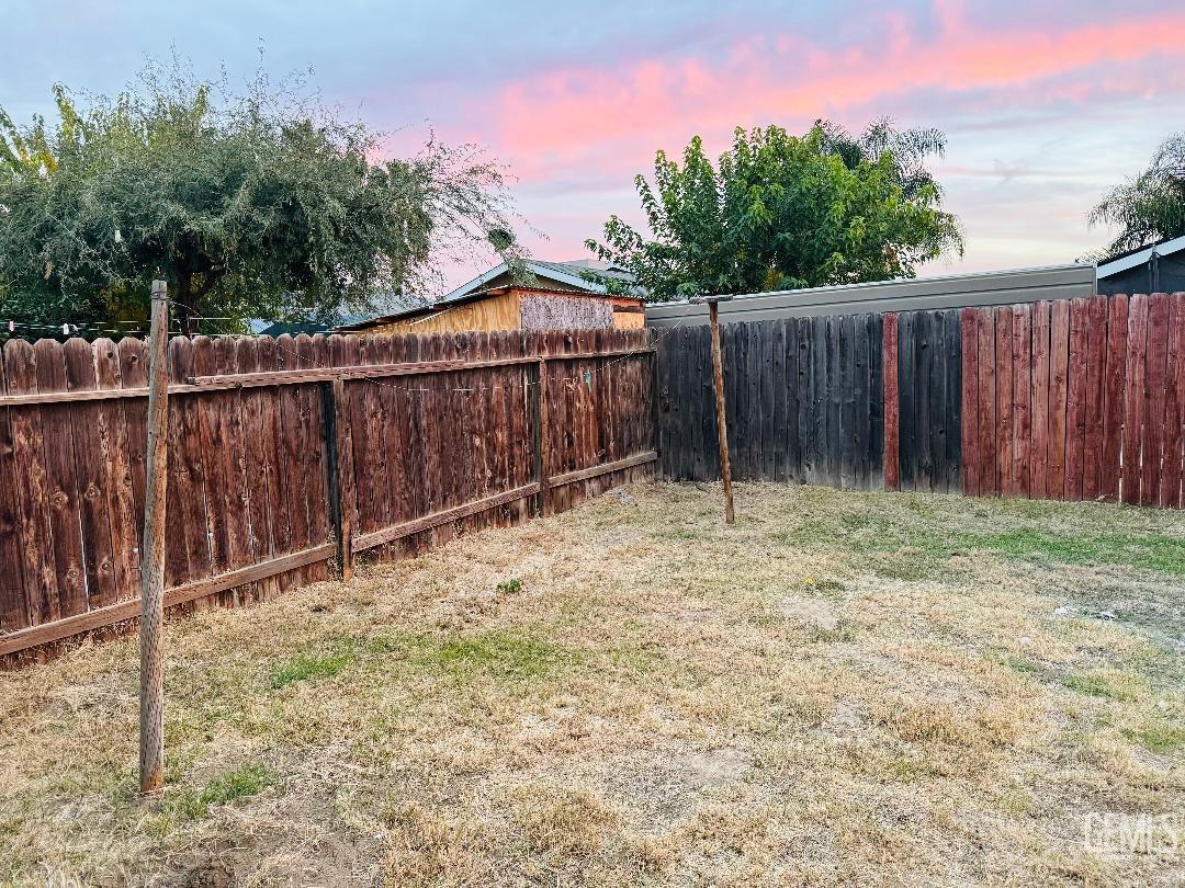 Undisclosed Address Arvin, CA 93203 - Photo 13 of 29 a backyard of a house with green landscape