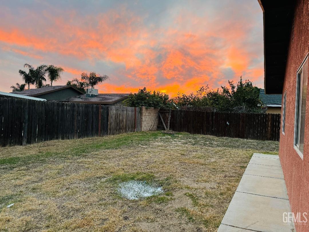 Undisclosed Address Arvin, CA 93203 - Photo 15 of 29 a backyard of a house with lots of green space