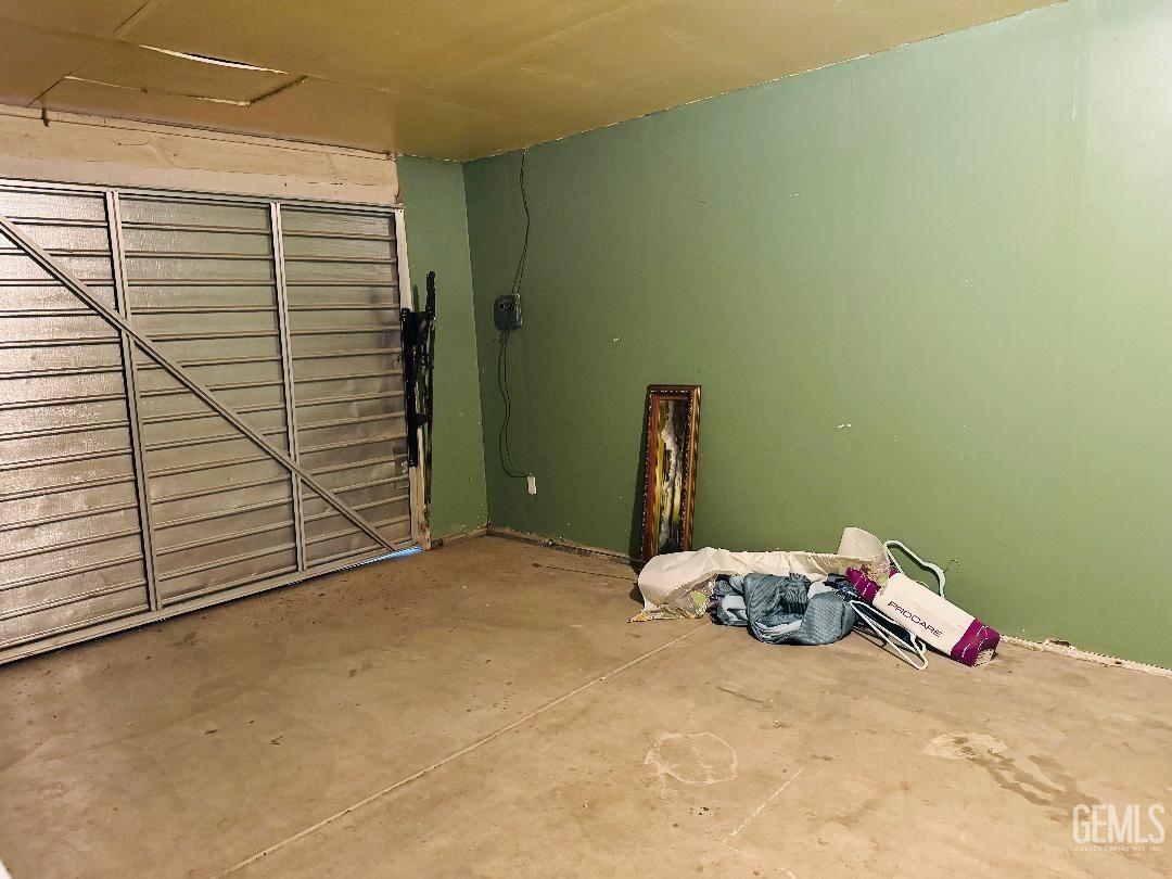 Undisclosed Address Arvin, CA 93203 - Photo 18 of 29 a bedroom with a bed and a window