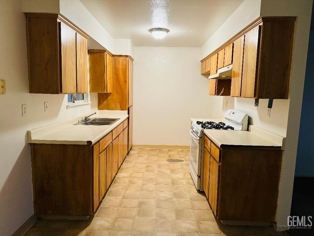 Undisclosed Address Arvin, CA 93203 - Photo 19 of 29 a bathroom with a sink and a mirror