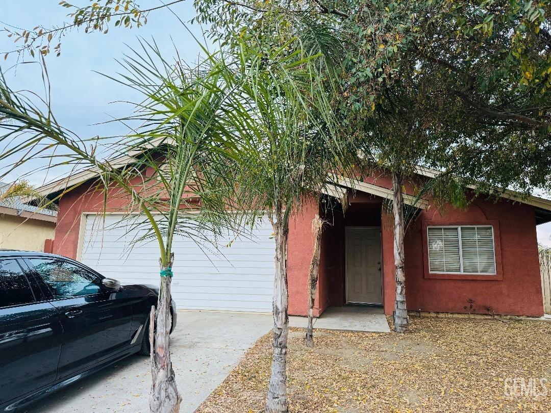 Undisclosed Address Arvin, CA 93203 - Photo 2 of 29 a view of a house with a large tree